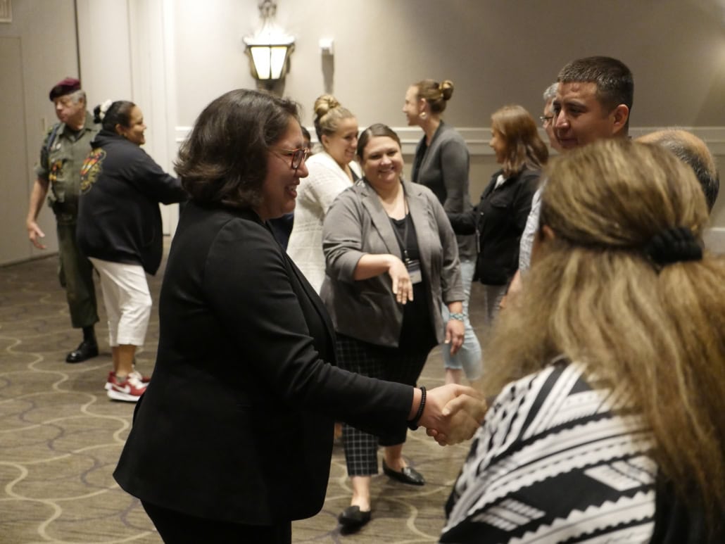 Dr. Myra Parker shaking hands with participants at ONOJ 2023.